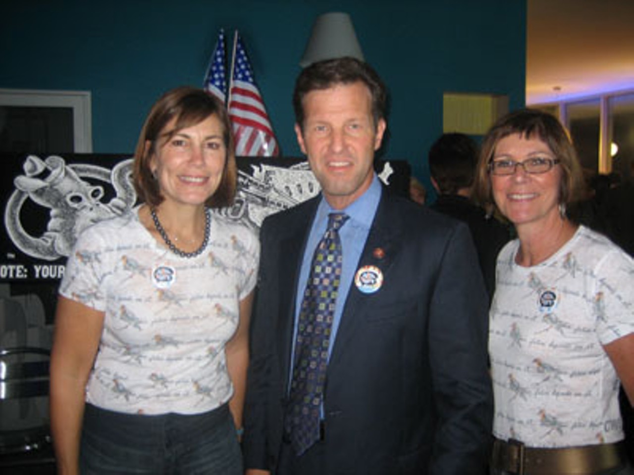Carnahan at Art the Vote: U.S. Rep. Russ Carnahan with Mary McElwain and Sue Mccollum, Art the Vote volunteers, stand in front of artwork by Tom Huck encouraging people to register to vote.