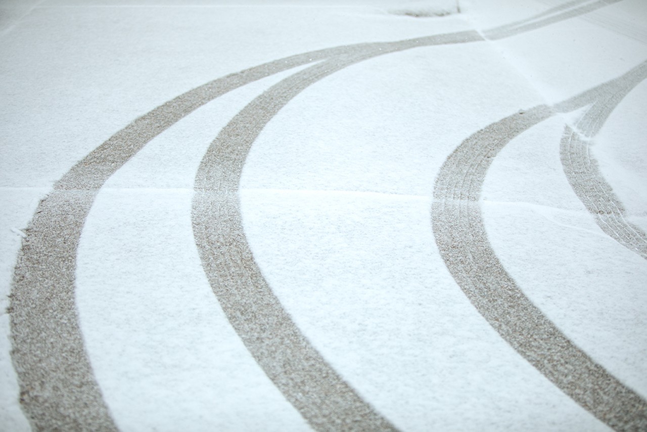 Snow covers tire tracks in south city.