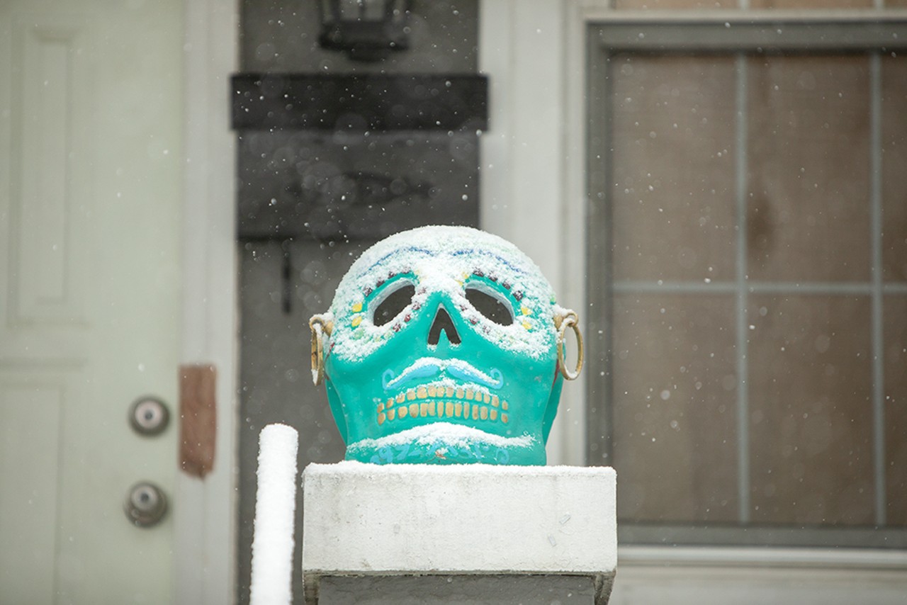 Snow falls on a Mexican Calavera skull on Friday, Feb. 16, 2024, in St. Louis.