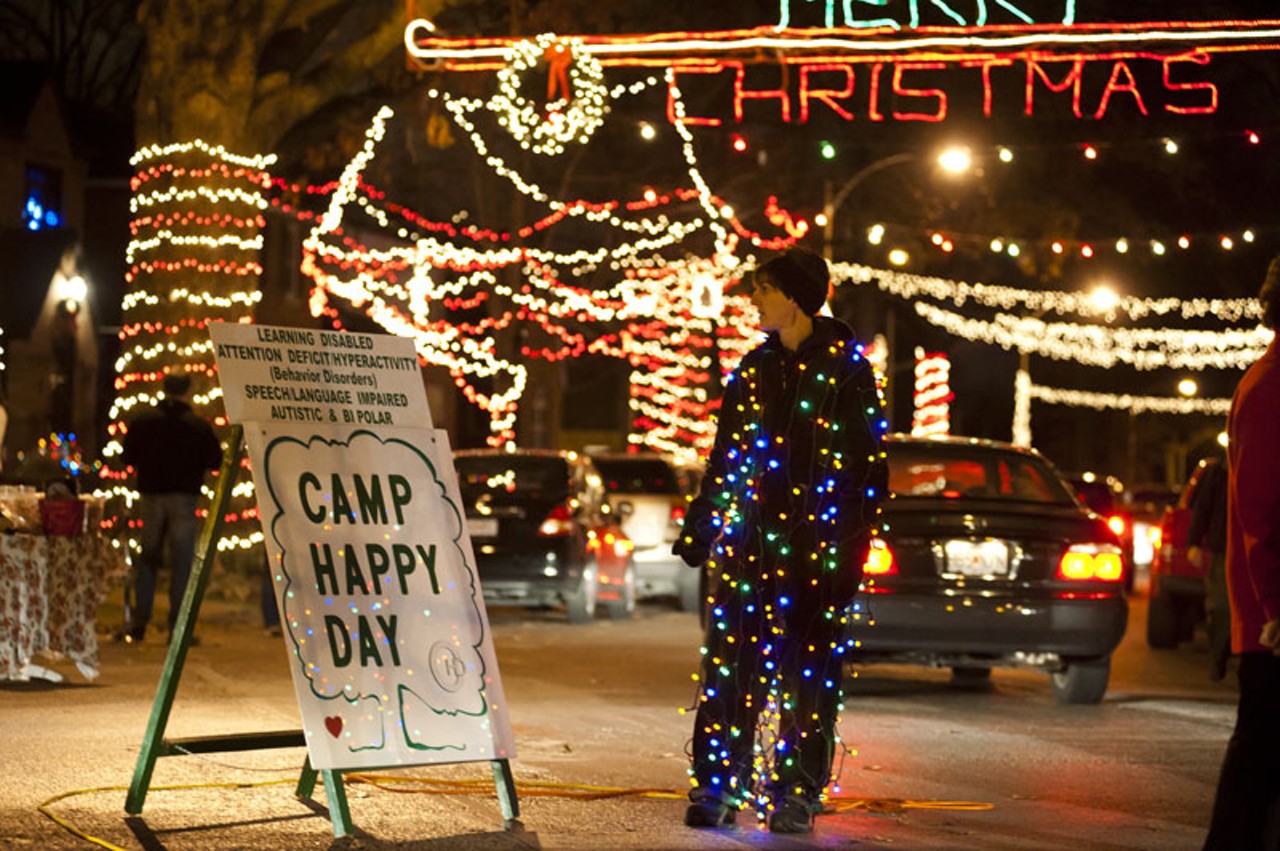 Missey Doll of St. Louis functions as traffic control and decor on "Candy Cane Lane."