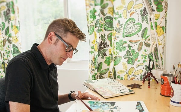 St. Louis-based illustrator John Hendrix works in his studio.