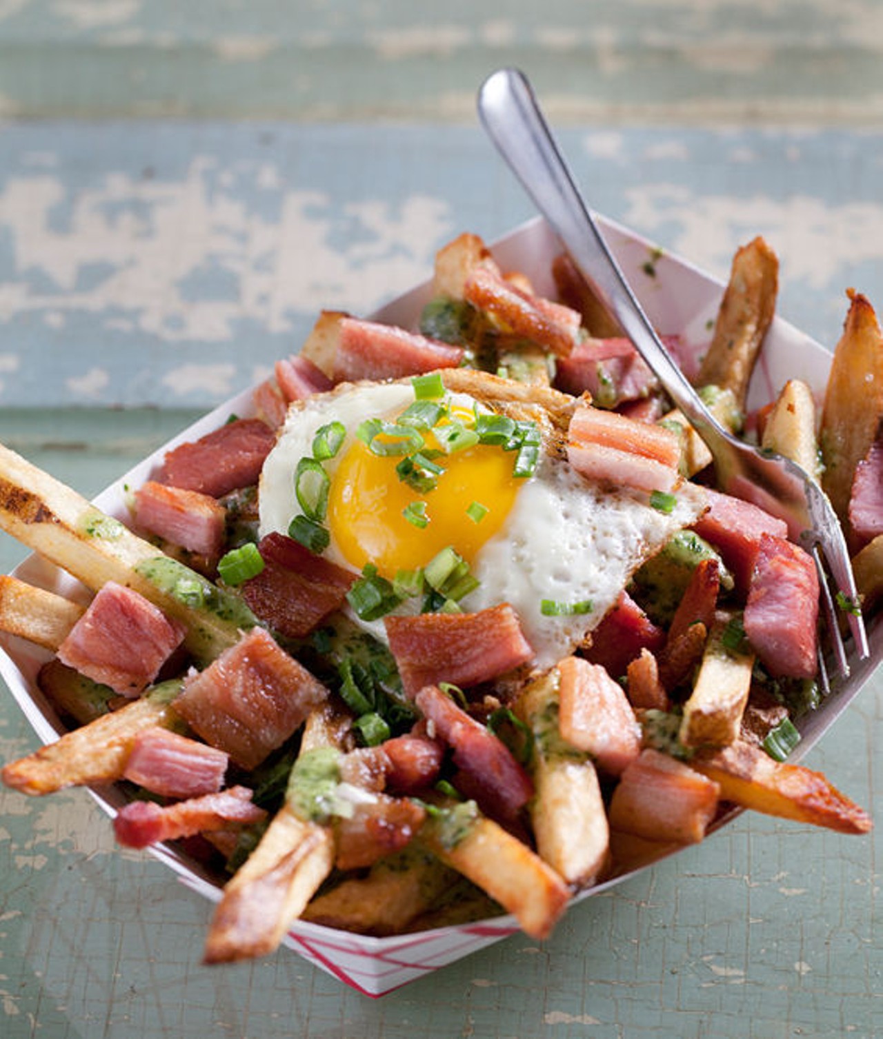One of the menu's "Boardwalk Fries," the "Green Eggs N Ham" is fresh cut Idaho russett potatoes tossed in sea salt, a fried egg, diced ham, creamed spinach, and green onion. See more photos from the Shack Pubgrub.