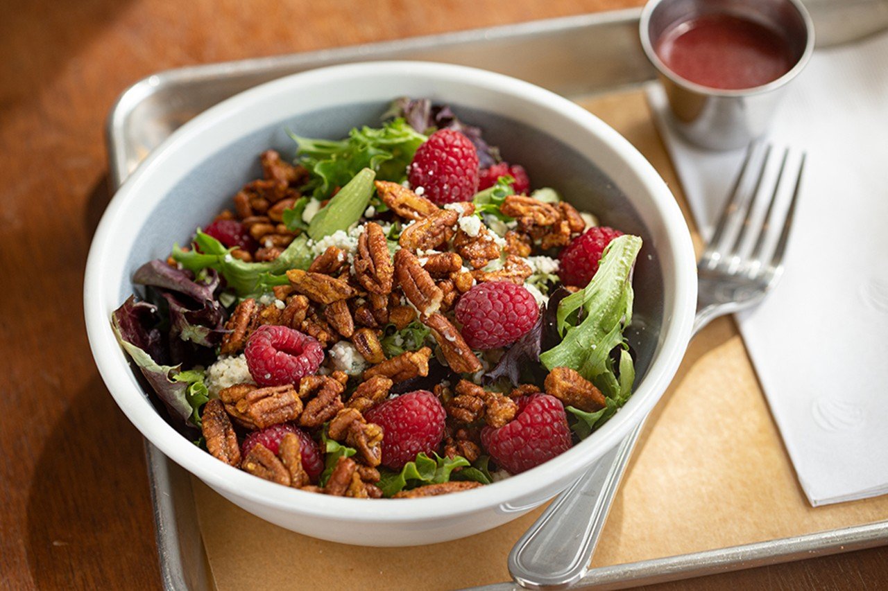 Spring salad with mixed greens, Gorgonzola, raspberries, spiced candied pecans and raspberry white balsamic vinaigrette.