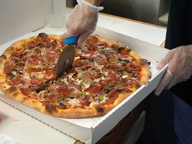 The Roberto pizza features pepperoni, hamburger, bacon, ham, capicola, sausage, garlic, mushrooms, black olives, green peppers and onions.