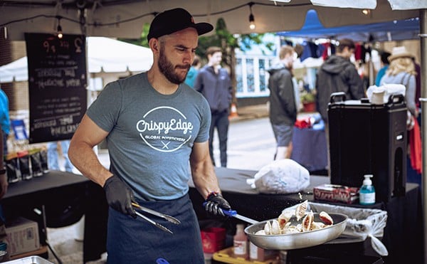 A Crispy Edge chef whipping up some delights at an outdoor festival in Maplewood.