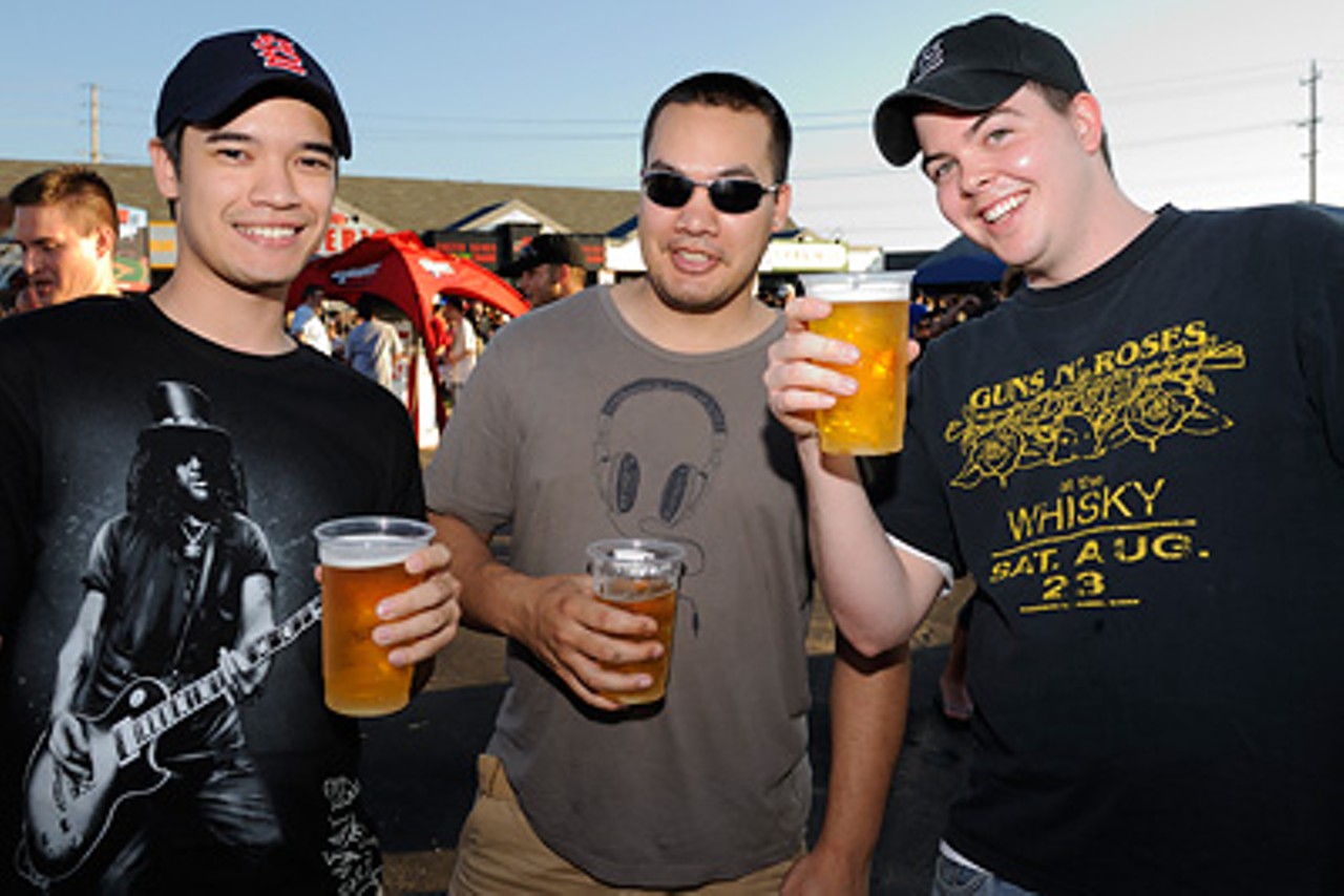 Gun 'n Roses t-shirts and beer were staple items for the show, with the latter providing much needed refreshment as temperatures soared to 95 degrees.