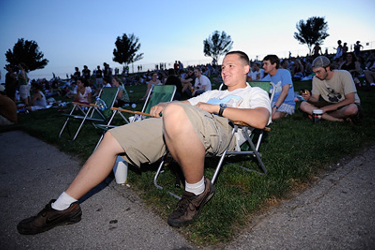 A fan lounging on the lawn during Chevelle's performance, just before the Stone Temple Pilots take the stage.