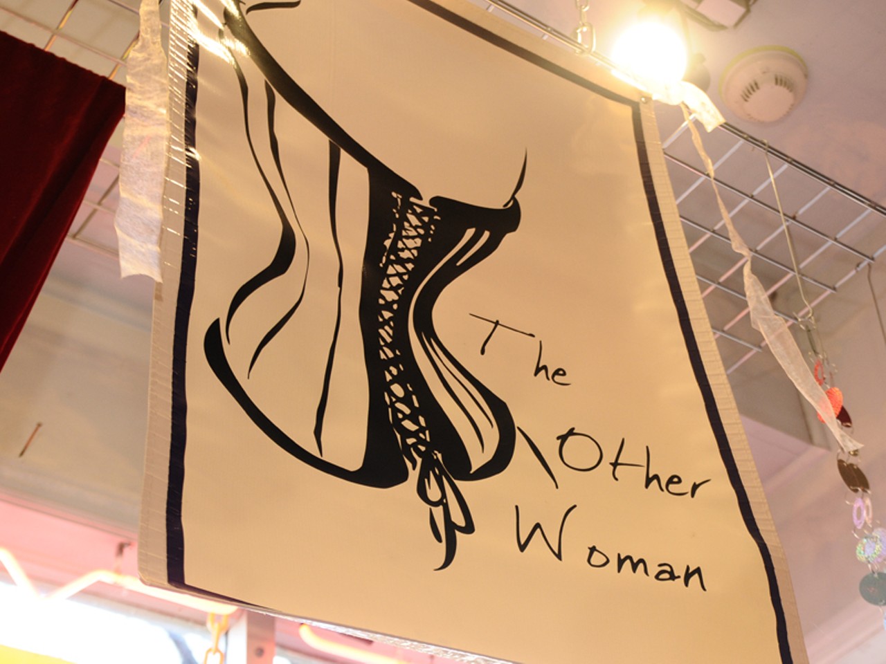 The business is called The Other Woman, because "she's the one who is always hot, despite the donuts." The styles are named after all the famous bad women of history. Corsets have the reputation of being something bad women wear. And also bad women were famously bad for being babes.
