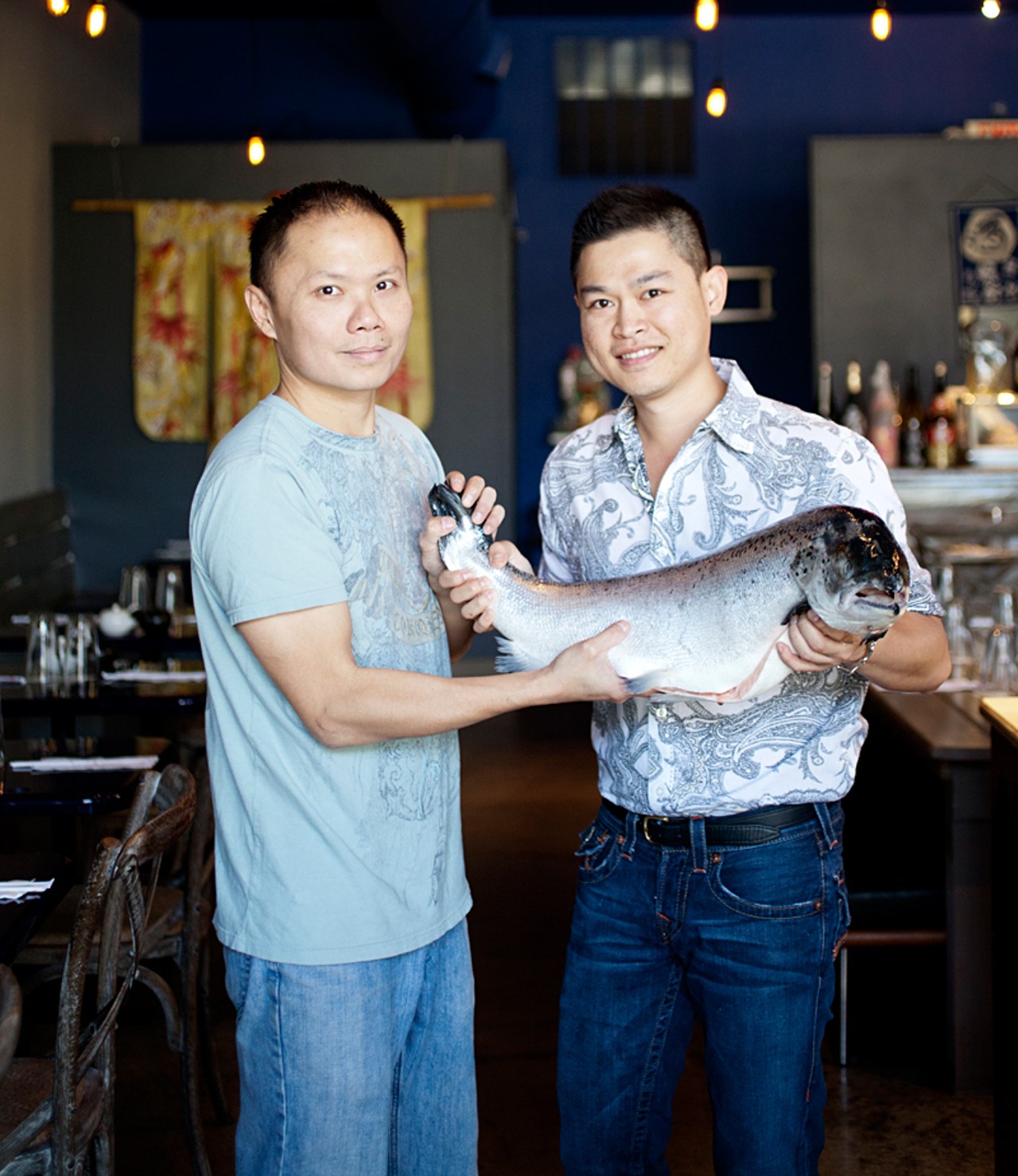 Hiro owners Sui Toh and Bernie Lee with a fresh, sushi-grade, 15 pound salmon.