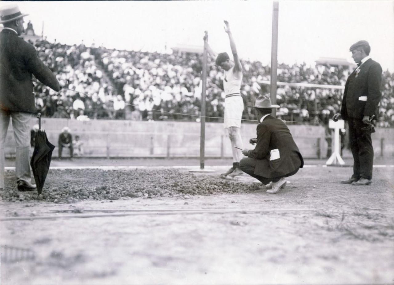 Ray Ewry competing in the standing broad jump at the 1904 Olympics.  He won the event. 
You can still visit where the games took place. Most events took place on Francis Field at Washington University. 