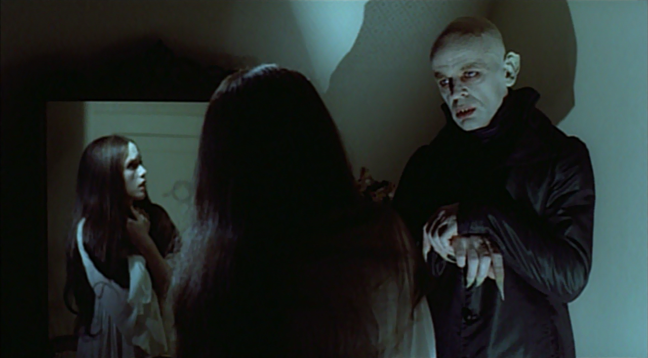 11. Nosferatu the Vampyre (1979)
From our 1979 review: "Werner Herzog's Nosferatue, the Vampyre presents in Klaus Kinski's Count Dracula a reasonable replica of Max Schreck's vampire in F.W. Murnau's Nosferatu. There is no seductive courtliness in this powdery-white-skinned, sunken-black-eyed creature of the night, only an animalistic compulsion to feast on the blood of his victims. Whereas Frank Langella, George Hamilton, and even Bela Lugosi masqueraded as the last playboys of the central European world, Kinski's Dracula rises from the mists of the psychic and social unconscious to bring pestilence, morbidity, and evil into a well-ordered bourgeois existence." -- J. Hoberman