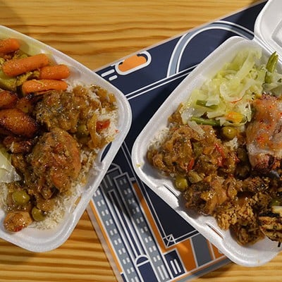 Buffet-style plates with multiple dishes from Chez Ali in the Food Hall at City Foundry STL