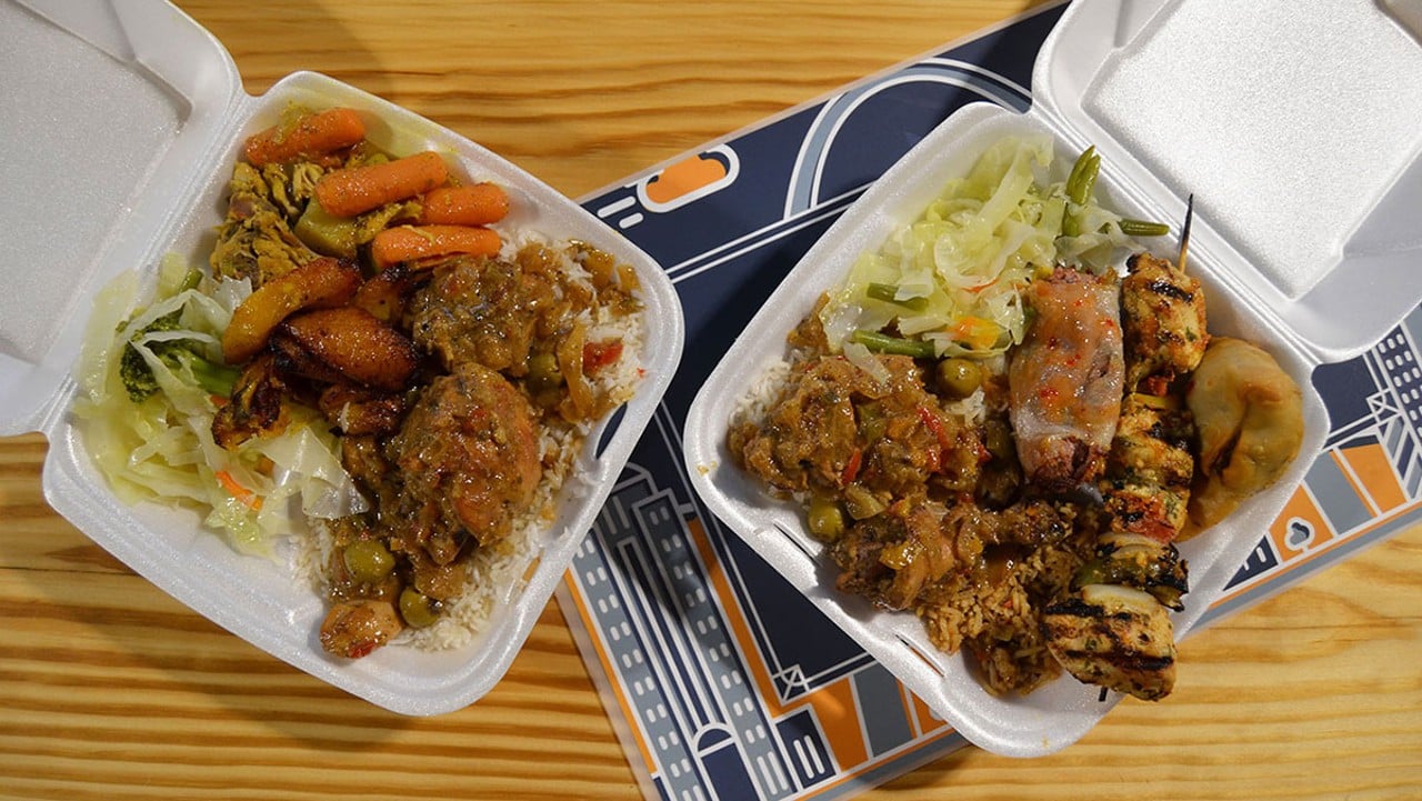 Buffet-style plates with multiple dishes from Chez Ali in the Food Hall at City Foundry STL