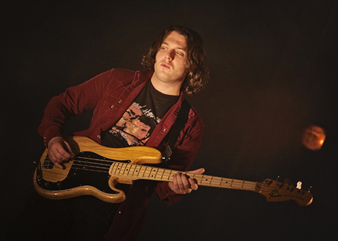 Nick O'Malley on the bass guitar.