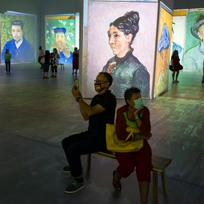 Van Gogh's portraits are projected onto the walls all at once.