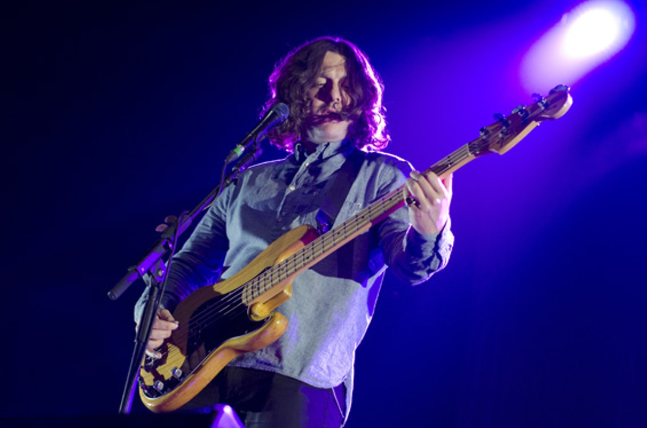 Nick O'Malley of Arctic Monkeys performing at the Chaifetz Arena in St. Louis on Friday, April 27.