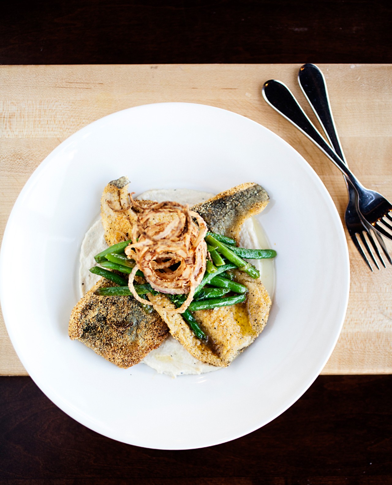 The Missouri trout at the Block is cornmeal-encrusted with roasted cauliflower, green beans, crispy onions and herb butter.