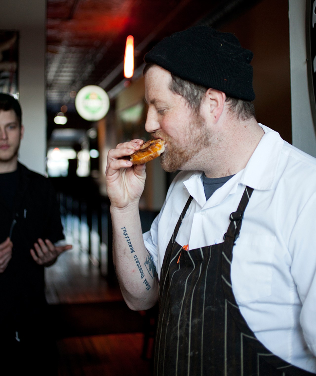 Executive Chef Jimmy Hippchen snacking on his grilled cheese sandwich.