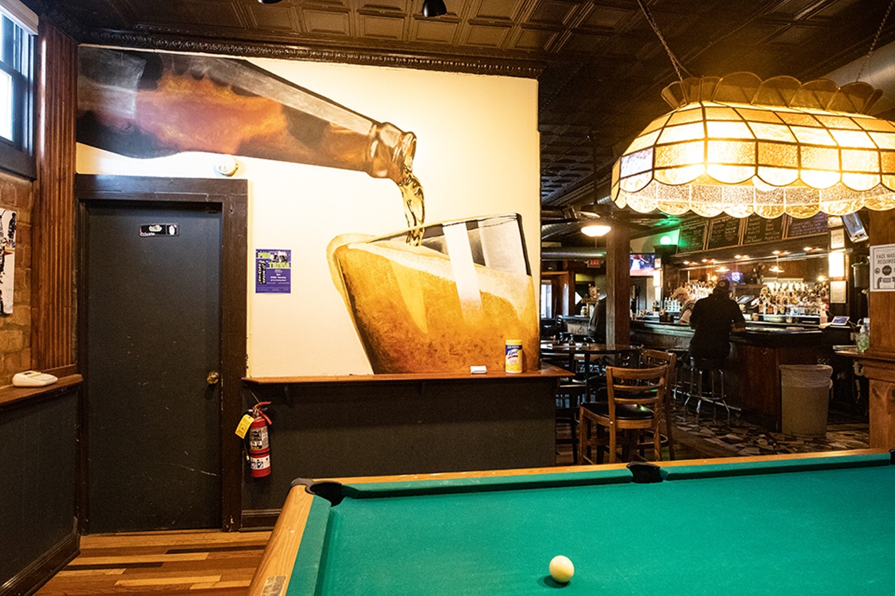 The back of the space features murals and a pool table.