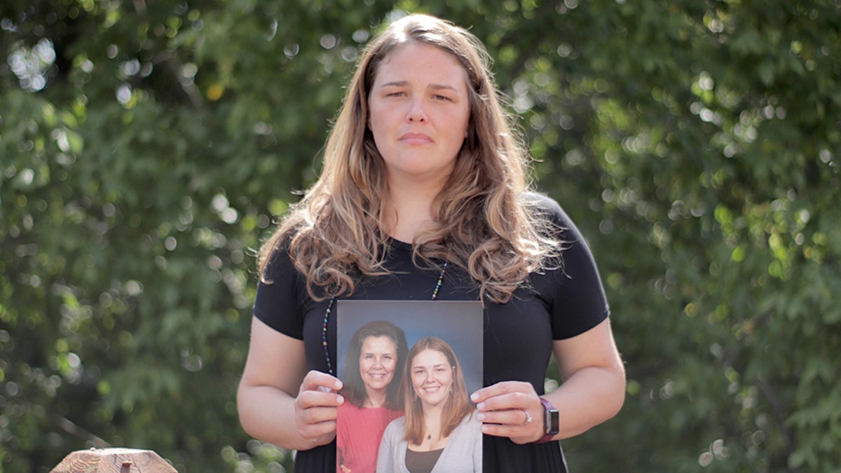 Angela Kender, holding a portrait of her mother, documents the toll COVID-19 has taken.