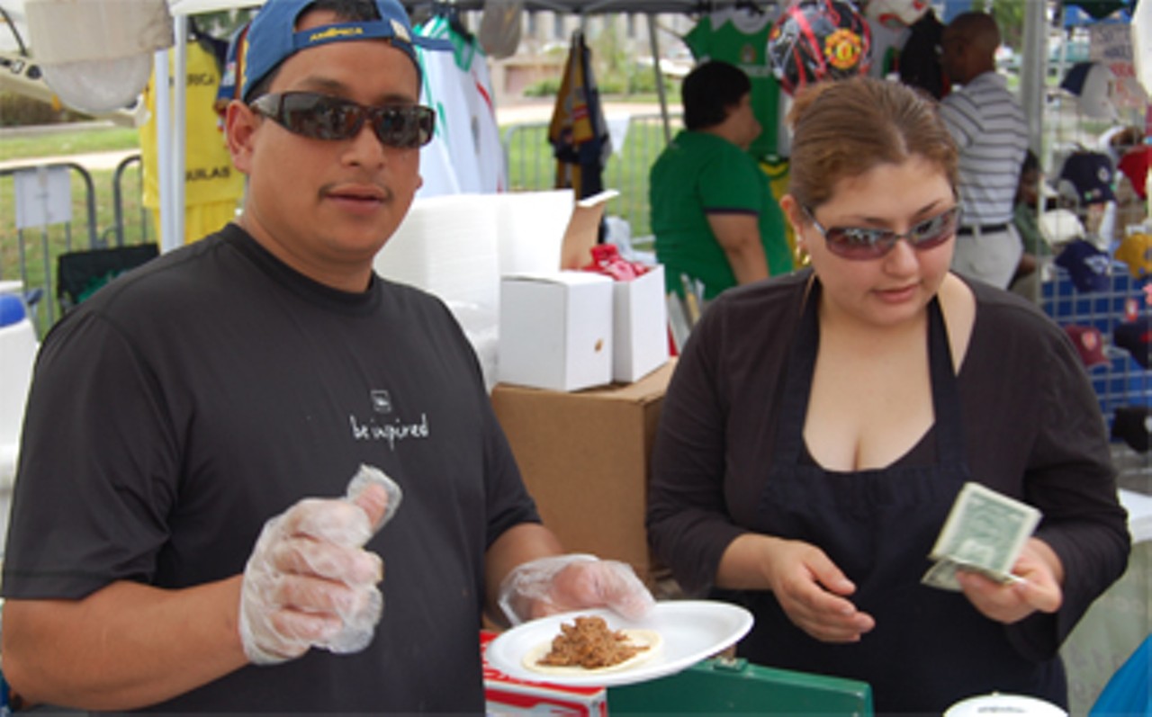 Preparing tacos at the busiest booth at the festival.