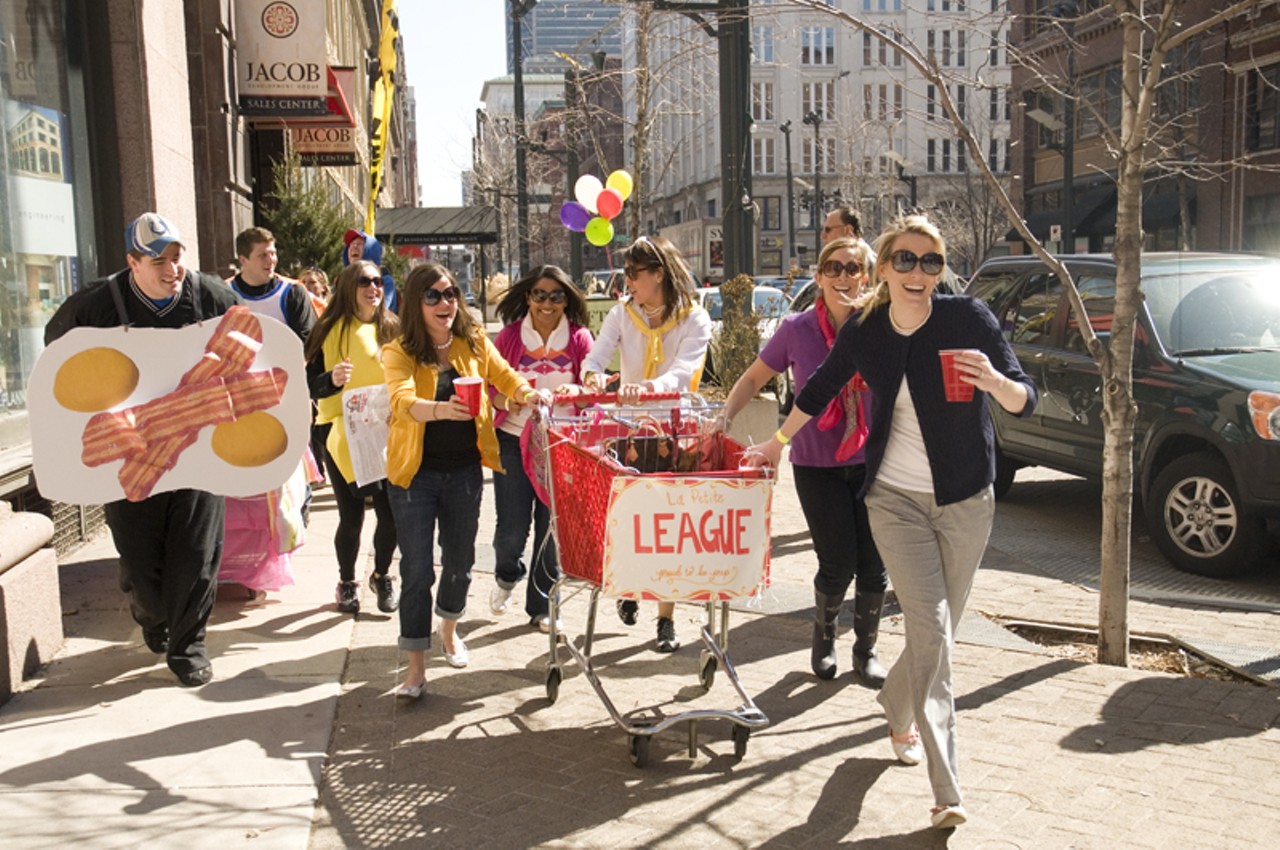 Members of La Petite League and Breakfast In Bed rush down Washington Avenue after completing their first challenge.&nbsp;