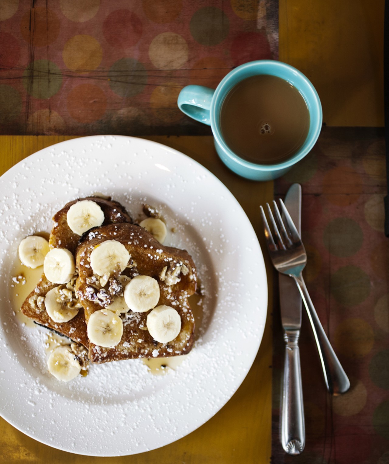 French Toast with apples and raisins or bananas. Shown here with bananas and coffee.