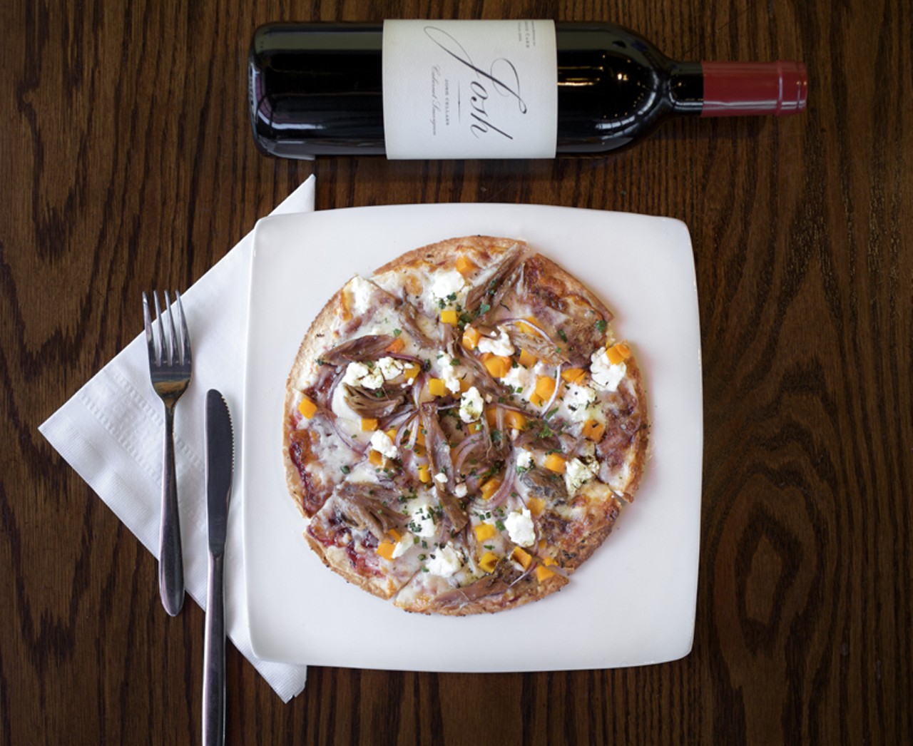 There are also four flatbreads featured on the menu, one of which is the Duck Confit Flatbread. It is made with a raspberry chipotle &ldquo;sauce,&rdquo; butternut squash and goat cheese. It is shown here with a Josh Cellars Cabernet Sauvignon.