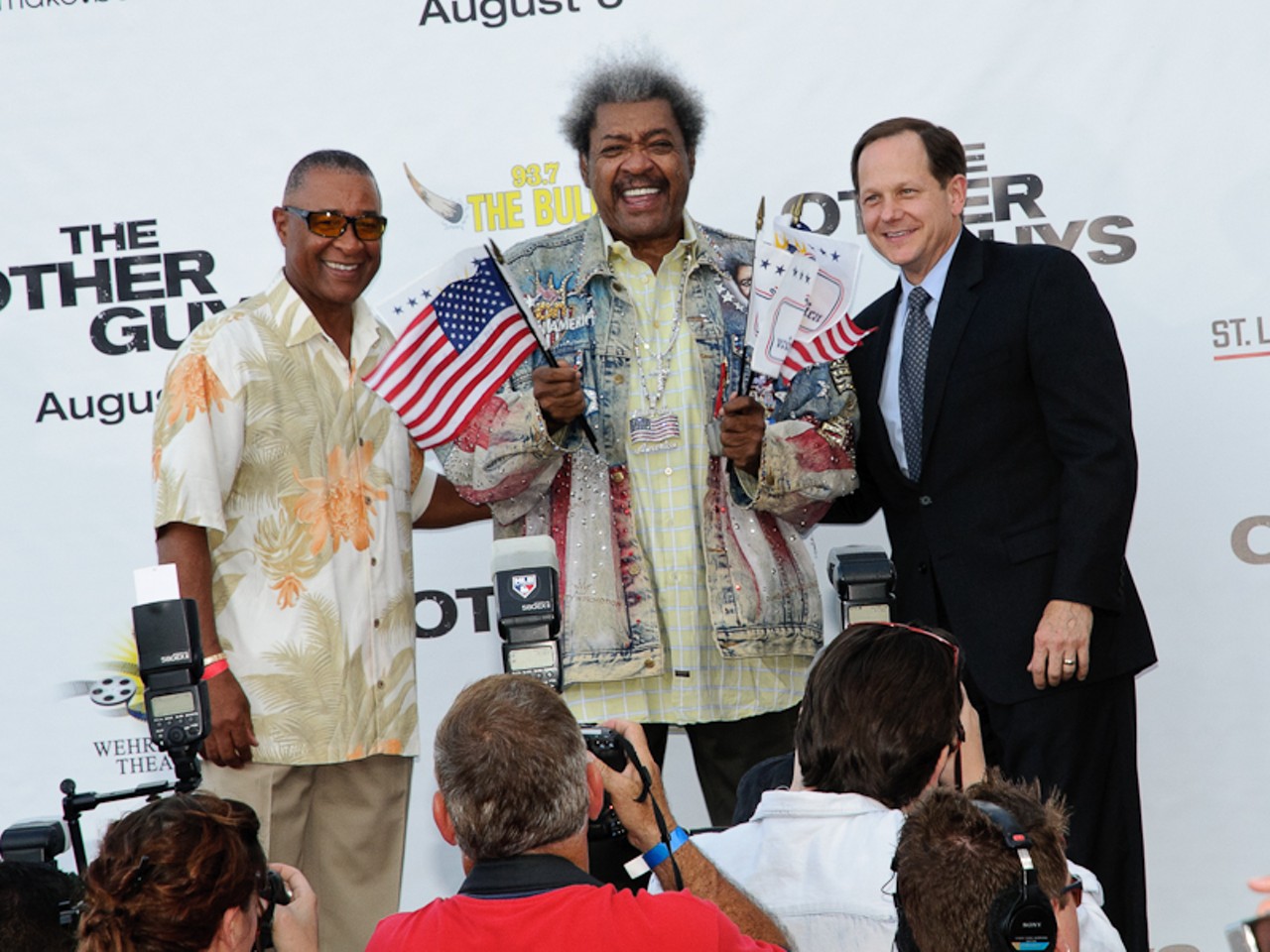 Local legend Ozzie Smith, wrestling promoter Don King, and St. Louis' Mayor Slay pose for a photo-op onstage before the premier.