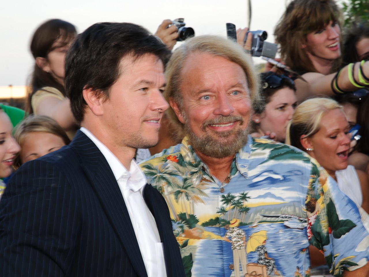 Mark Wahlberg and Joe Edwards pose for photos on the red carpet.