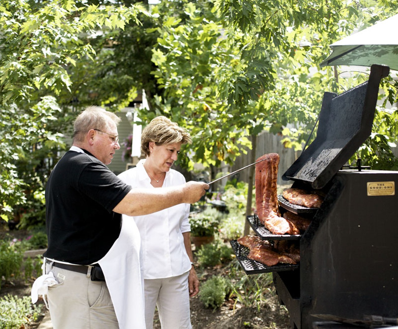 Owner's Maggie and Nick Collida checking on the ribs in the smoker behind the restaurant.