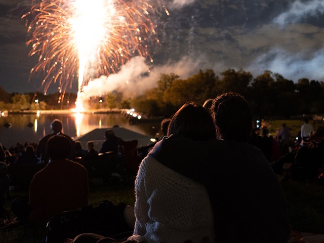 A couple views the fireworks finale at the free St. Louis Symphony Orchestra concert in 2021.