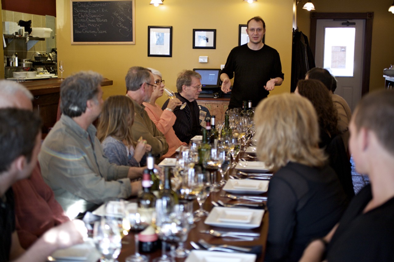 Bartender and wine educator Joshua Renbarger telling the supper club guests about the evening&rsquo;s wine selections that have been chosen to accompany Chef Cassandra Vires &ldquo;Family Style Italian&rdquo; night.