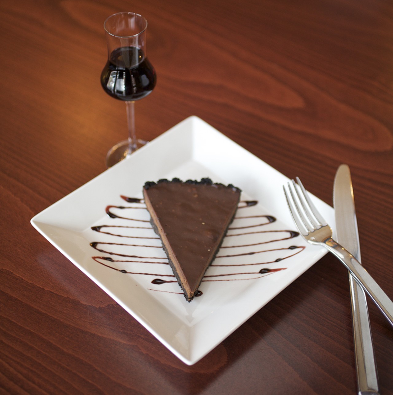Chocolate Tart with a port reduction is shown here with a glass of Noval Black Port.