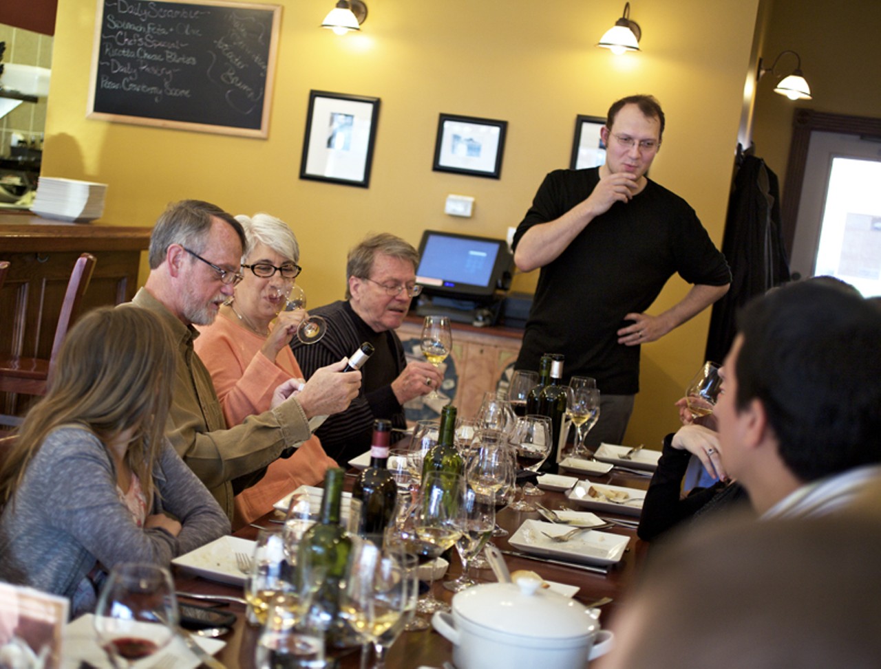 Bartender and wine educator Joshua Renbarger discusses the evenings wine choices with supper club guests.