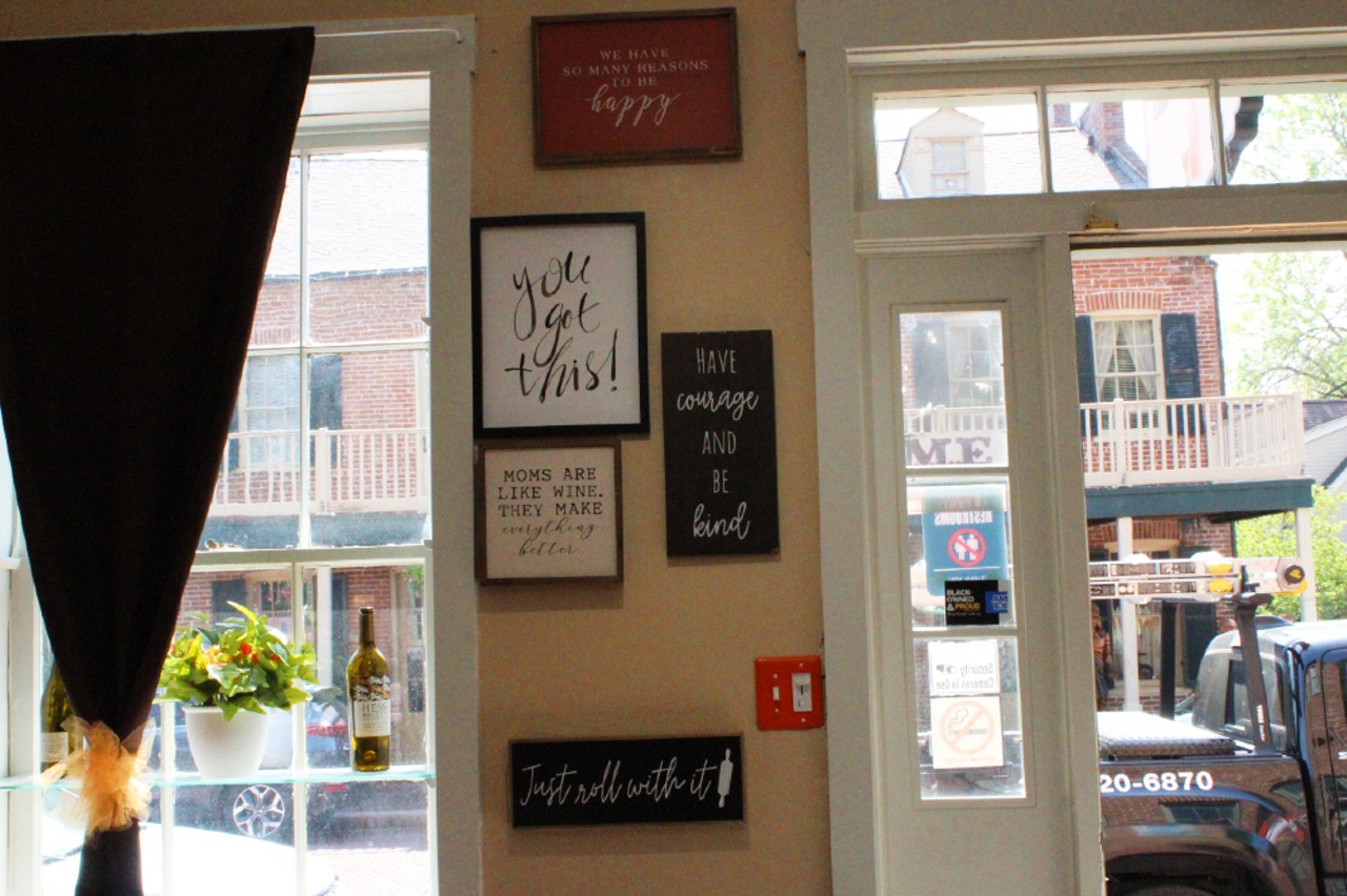 Signs hang up inside the cafe.