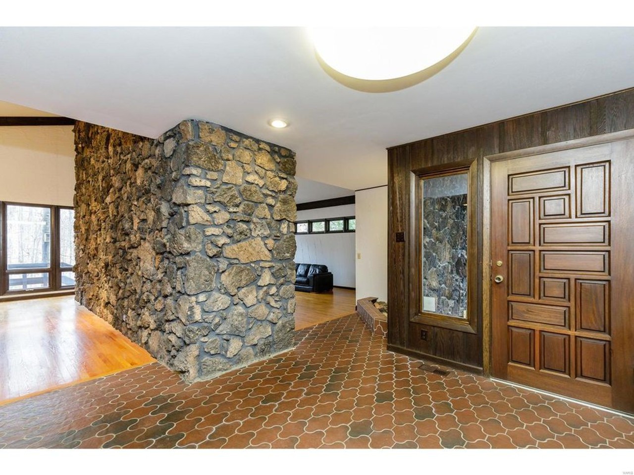 This Modern House Has a Rock Wall and a Huge Bar in the Basement [PHOTOS]