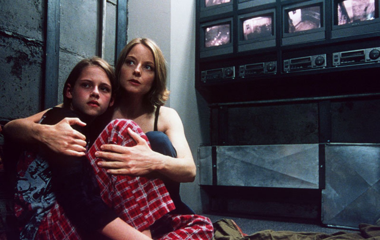 Panic Room (2002): 
In this thriller starring Jodie Foster, a mother and her daughter (a young Kristen Stewart) hide in the panic room of their house to escape burglars who have come after hundreds of thousands of dollars in the safe. Over the course of the night that they're hidden, Foster's diabetic daughter's health fades. and Foster must try to retrieve her daughter's medication from out in the house without being caught. Not even her own home is safe any more, and the safest place looks like it could mean death.