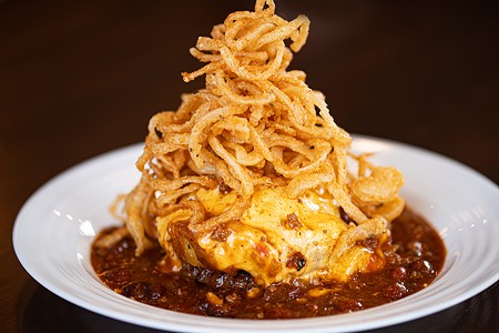 The slinger is made with a quarter-pound prime patty, hash, chili, American cheese and onion hay.