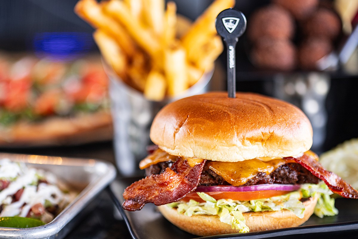 Topgolf's Smokehouse burger comes with bacon, barbecue sauce, cheddar, lettuce, tomato, onion and secret sauce.