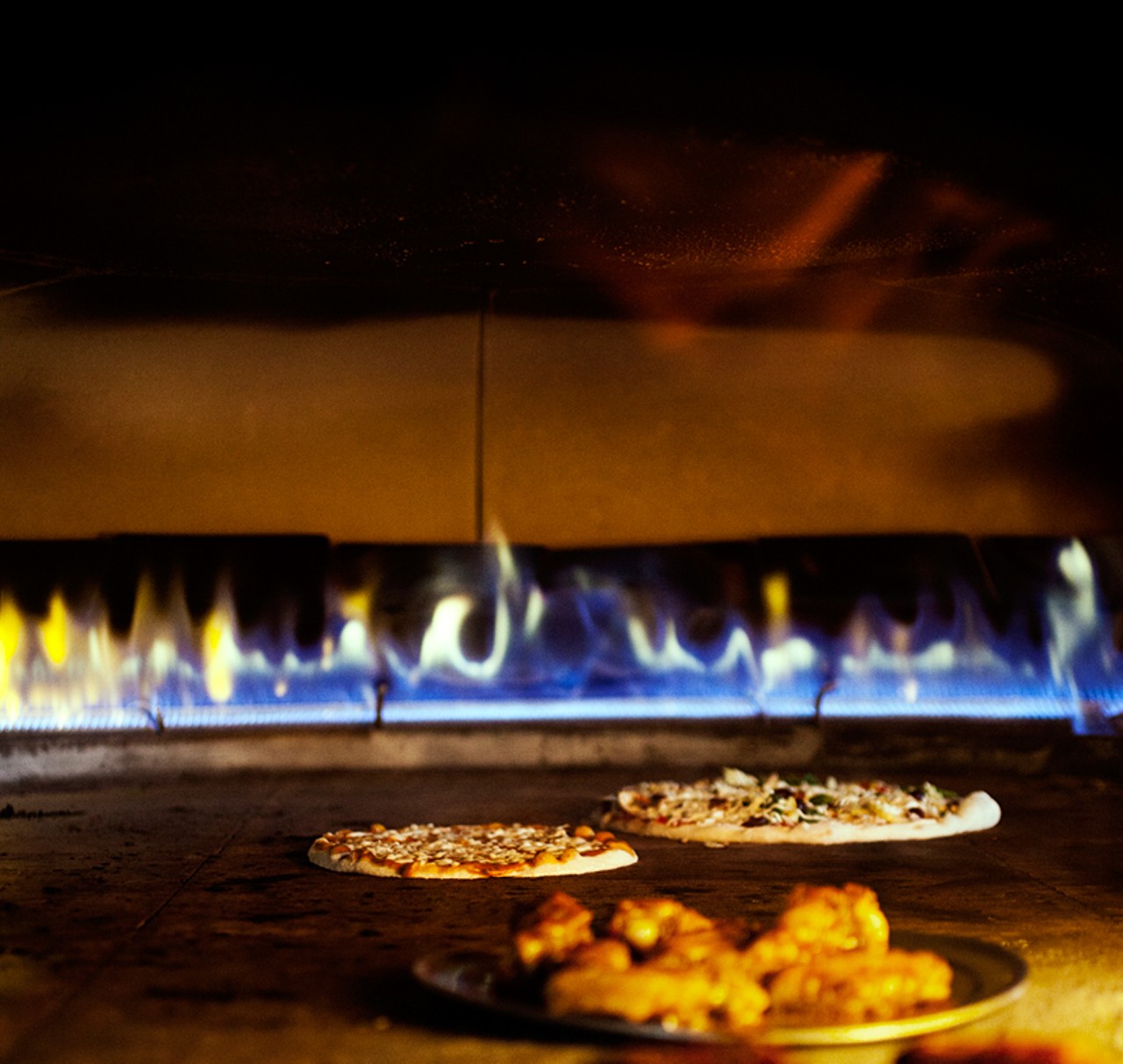 Wings and pizza in the wood-fired oven at twinOak.