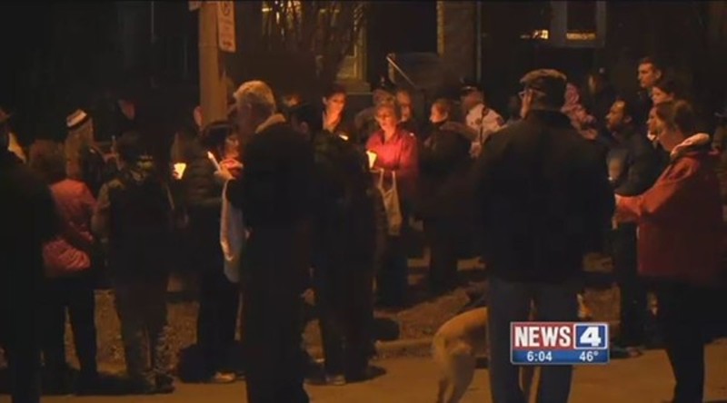 Neighbors held a vigil on Juniata after a grandfather's slaying. - SCREENGRAB VIA KMOV