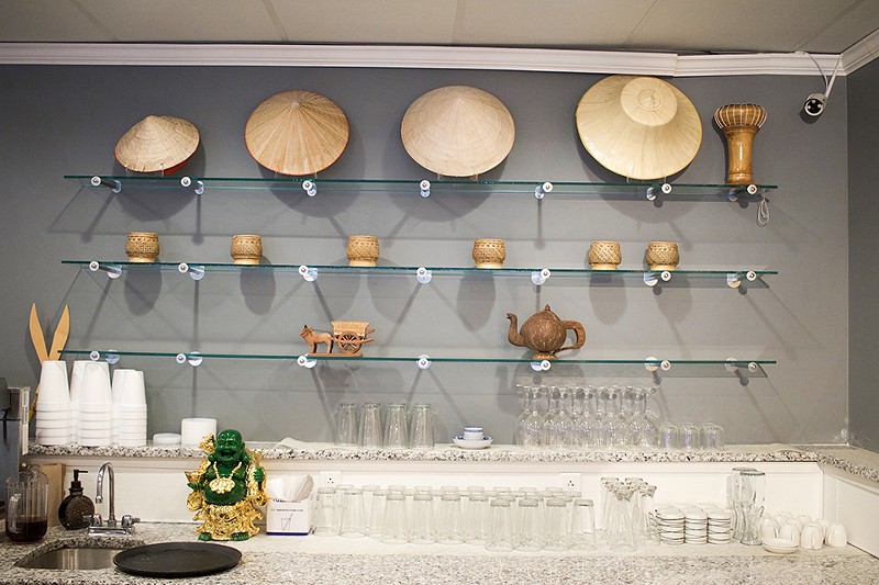 Traditional serving implements decorate the bar area. - CHERYL BAEHR