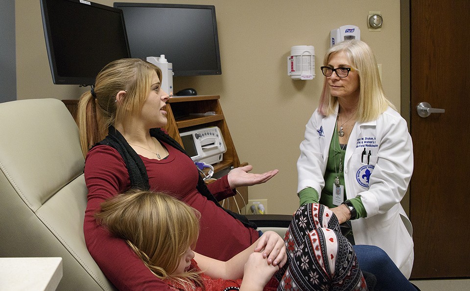 Rio Clemens sits with her daughter Kylie, while talking with Dr. Jaye Shyken. - NICK SCHNELLE
