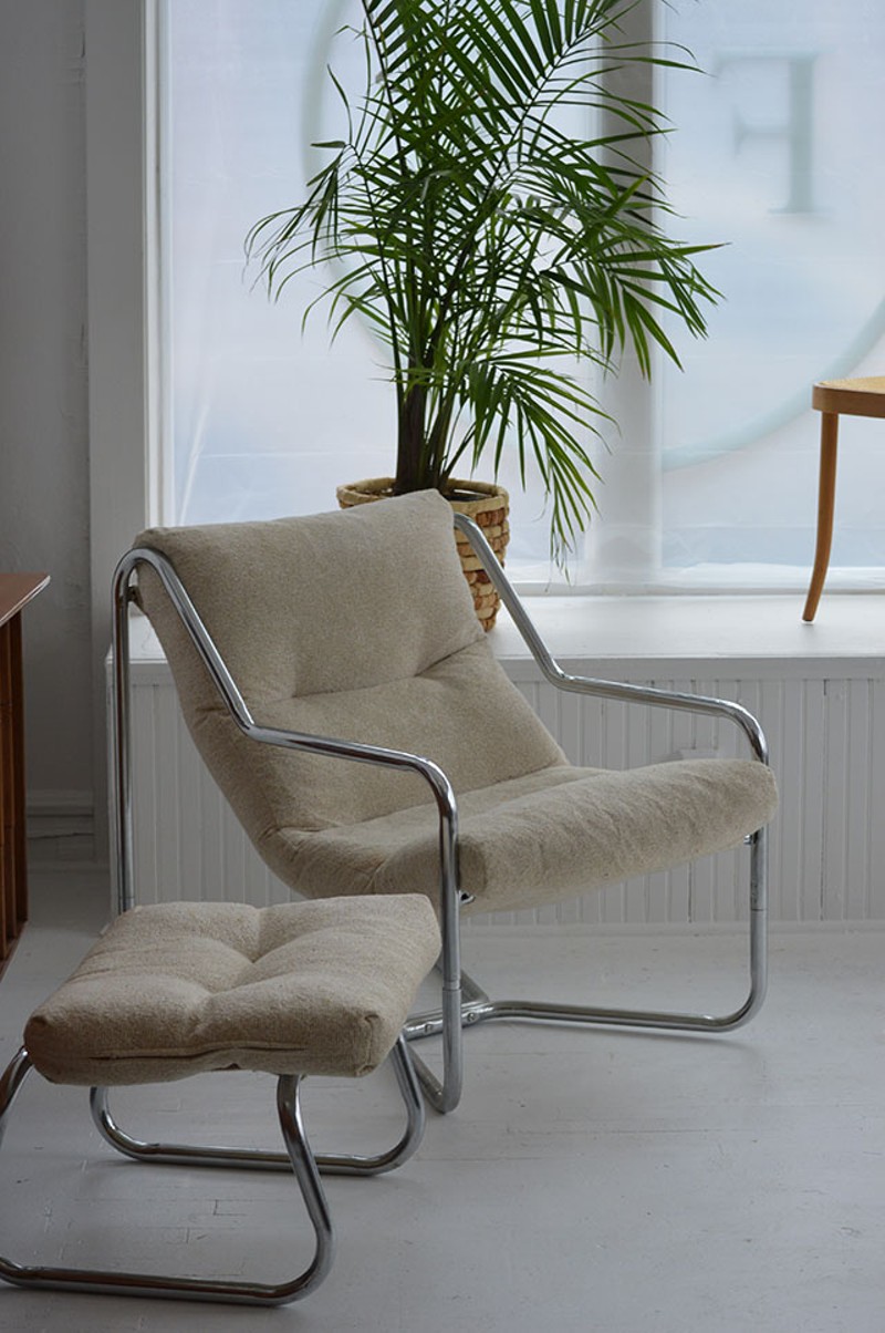 This mid-century chair and ottoman exemplify the store's modern look. - MEGAN ANTHONY