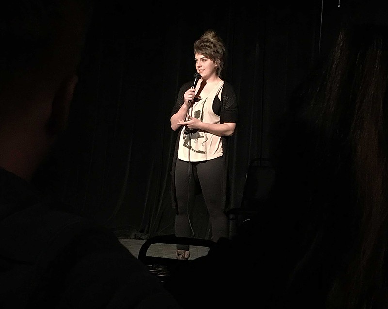 Improv Shop student Livie Hall gives stand-up a whirl at open mic night. - KELLY GLUECK