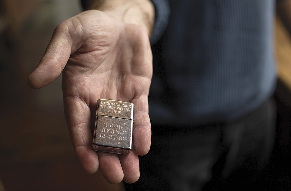 Hutchinson treasures mementoes from his son's life, including this Zippo lighter. - MONICA MILEUR