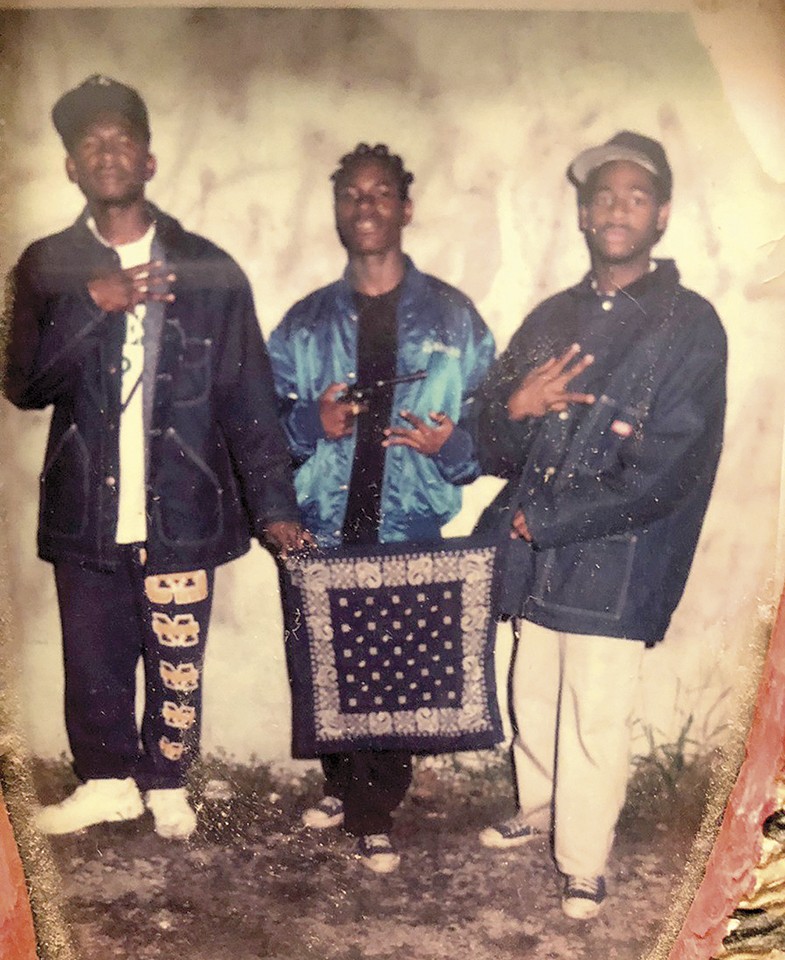A 1992 photo of Sultan Muhammad (center) from his days as a Crip in the 41 Delmar Mob. - COURTESY OF SULTAN MUHAMMAD
