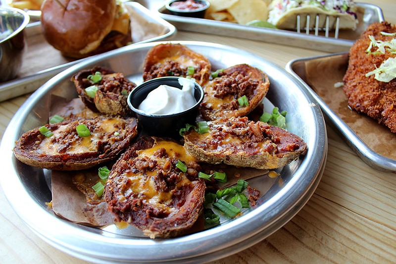 Potato skins are laden with bacon. - LEXIE MILLER