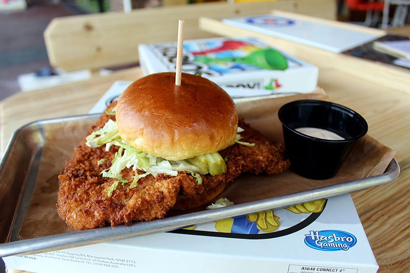 The pork tenderloin sandwich is topped with lettuce, pickle and chipotle mayo. - LEXIE MILLER
